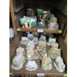 A collection of Lilliput Lane cottages, and Hornsea Pottery Fauna figurines (33)