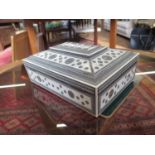 A 19th century Anglo-Indian inlaid ivory Sadeli sewing box, of sarcophagus form with fitted