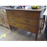 An Edwardian mahogany and satinwood crossbanded bedroom chest, with two short and two long drawers