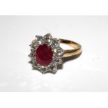 18ct yellow gold ruby and diamond cluster ring. Ruby 2.25ct. Total diamond carat weight 1.50ct