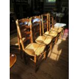 A set of six 19th century French ash ladderback dining chairs with rush seats, on turned legs and