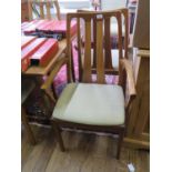 A set of six teak dining chairs by Nathan, including two carvers, with open splat backs, and a