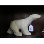 A large matt glazed pottery model of a polar bear in the Art Deco style, unmarked