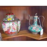 A Chinese teapot with metal decorations and a Famille rose ginger jar