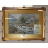 J.M. Brown Houses and figures by a river rapids watercolour signed 36 x 53 cm