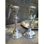 A pair of silver candle sticks, modern, Birmingham 1970,loaded, 18cm high.