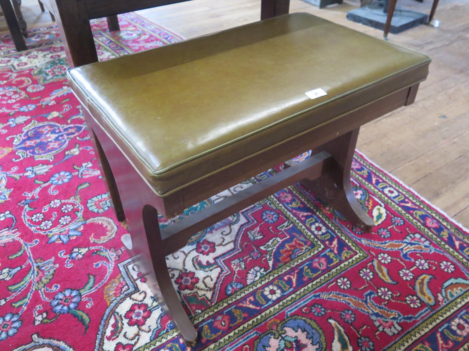 A mahogany organ stool, with leather overstuffed hinged seat, 68 x 43 cm, 56 cm high