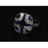 A Platinum Art Deco-style sapphire and diamond panel ring. Size M and a half