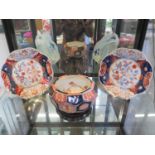 A Japanese Imari faceted circular bowl with Scroll and Cranes design to interior, 18cm diameter, and