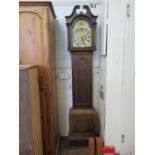 An early 20th century oak longcase clock, the swan neck pediment over a brass 10" dial with matted