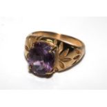 A 9 carat gold ring set with an amethyst. Size R and a half