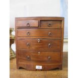 An early 19th century crossbanded mahogany apprentice piece miniature bowfront chest of drawers,