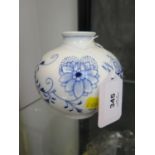 A Meissen blue and white globular vase, with floral and foliate scroll decoration, cross swords mark