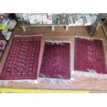 Three small Bokhara style rugs, with single row of guls on red grounds, largest 102 x 60 cm