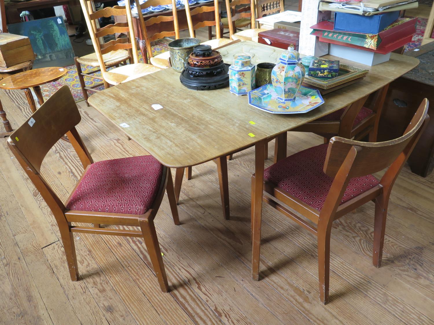 A 1950s G-Plan 'Brandon' range teak dining room suite, comprising a drop leaf table with four dining