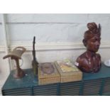 Two Indian Sadeli boxes, 22 cm wide, a carved wood head rest, a brass opium pipe and a bust of a