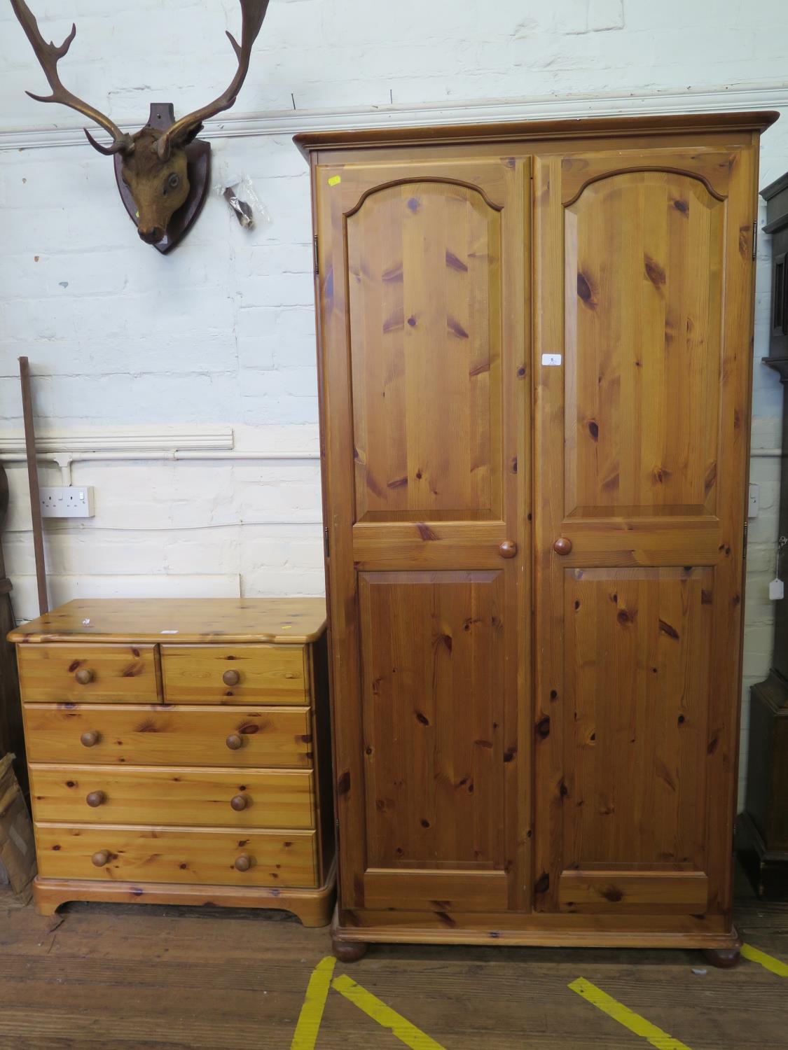 A pine twin door wardrobe, 97 cm wide, 54cm deep, 184 cm high, and a similar chest of two short