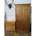 A pine twin door wardrobe, 97 cm wide, 54cm deep, 184 cm high, and a similar chest of two short