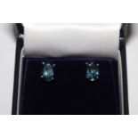 Pair oval London topaz studs, in silver