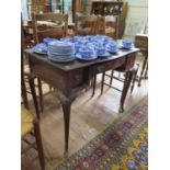 A 1920s mahogany lady's writing table, the leather top over a bowed drawer and two other frieze