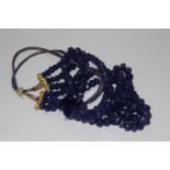 Earth mined 3 strand blue round faceted beads necklace on a adjustable cord with tassle. 983.50ct
