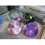 Four glass paperweights including Caithness, Selkirk Glass Celebration 1997 and Haley's Comet 1986