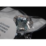 An 18ct white gold large aquamarine and diamond dress ring. Aquamarine 6.77ct. Diamonds 1.06ct