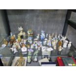 A collection of Wade Whimsies, including Tom and Jerry, Disney characters, gnomes and others, also