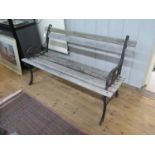 A cast iron and wood garden bench, 123cm