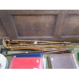 A Regimental swagger stick, with worn brass knop, a walking stick applied with military and
