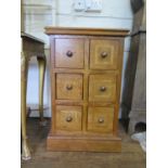 A fruitwood inlaid chest of six square drawers, on a plinth base, 48 cm wide, 48 cm deep, 77 cm high