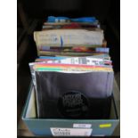 A collection of 45 rpm single vinyl records, including The Beatles (She Loves You, I Want to Hold