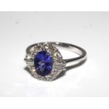 18ct white gold oval tanzanite and diamond cluster ring. Tanzanite 1.54ct. Diamonds 0.57ct [TP 0.