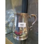 A George II silver mug on single foot, Richard Rug I,London 1749, with an engraved cartouche (