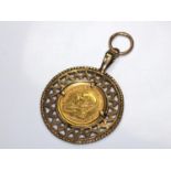 A Quarter Ounce Krugerand set in a 9 carat gold pendant mount