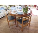 A teak extending circular dining table, and four dining chairs, 120 cm wide (5)