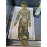 A Thai puppet style figure, made from coins with applied vellum and gilded timber face, hands and