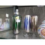 A coloured glass cocktail shaker with silver plated lid and five matching glasses
