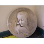 A carved marble roundel depicting a girl with a dove, 45 cm diameter