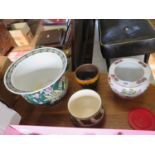 Four various pottery planters, two with floral and bird enamelled decoration