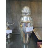 A novelty silver plated shaker, the detachable cover with golf ball finial, 18cm high