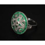 A Large stylish platinum vintage style emerald and diamond cocktail ring. Old cut diamonds 0.58ct