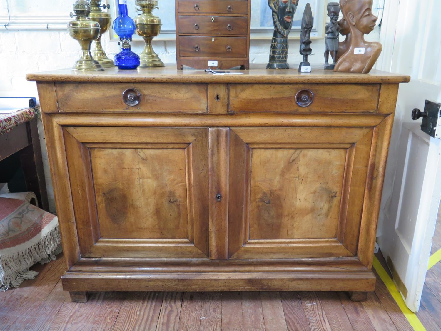 A 19th century French cherrywood buffet or sideboard, with two frieze drawers over a pair of