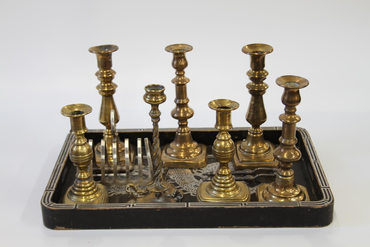 Seven 19th century Brass Candlesticks and a Chinese tray (8)