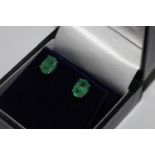 Pair oval emerald studs set in silver
