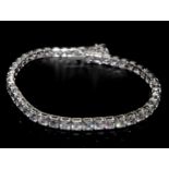 18ct white gold diamond line bracelet set with 8.20ct round brilliant cut diamonds in four claw