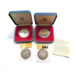 Two Victorian silver crowns and two cased silver jubilee commemorative crowns, 1977