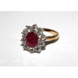 18ct yellow gold ruby and diamond cluster ring. Ruby 2.25ct. Total diamond carat weight 1.50ct. Size
