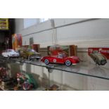 Tinplate friction-powered toys including Fire Truck, Minister DeLux, Sports Car and Saloon, three