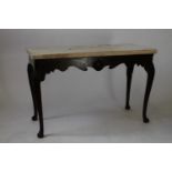 A Fine Irish Marble top Mahogany Console table. Circa 1750. Of oblong form. With a carved frieze